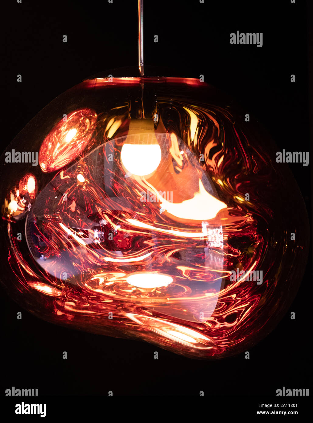 Tom Dixon spherical metallic pendant light hanging in the Tom Dixon