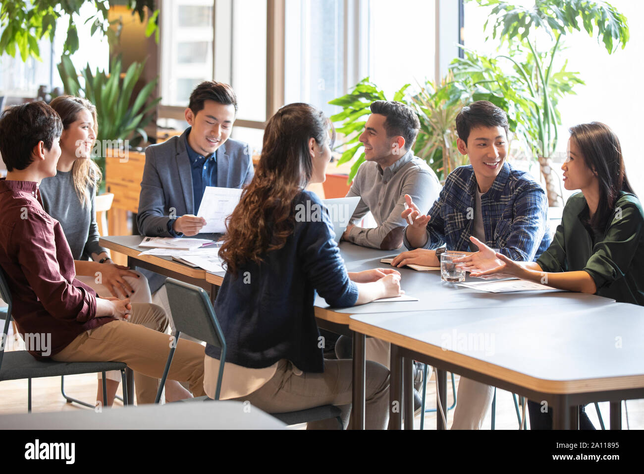 Young abroad students talking with teacher Stock Photo - Alamy