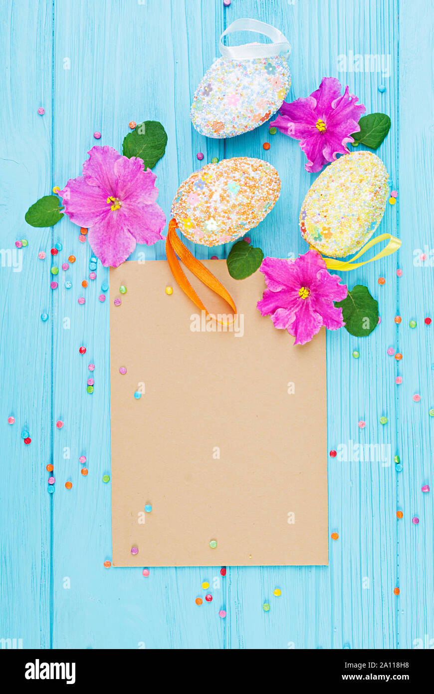 Easter background with flowers and easter eggs. Top view Stock Photo
