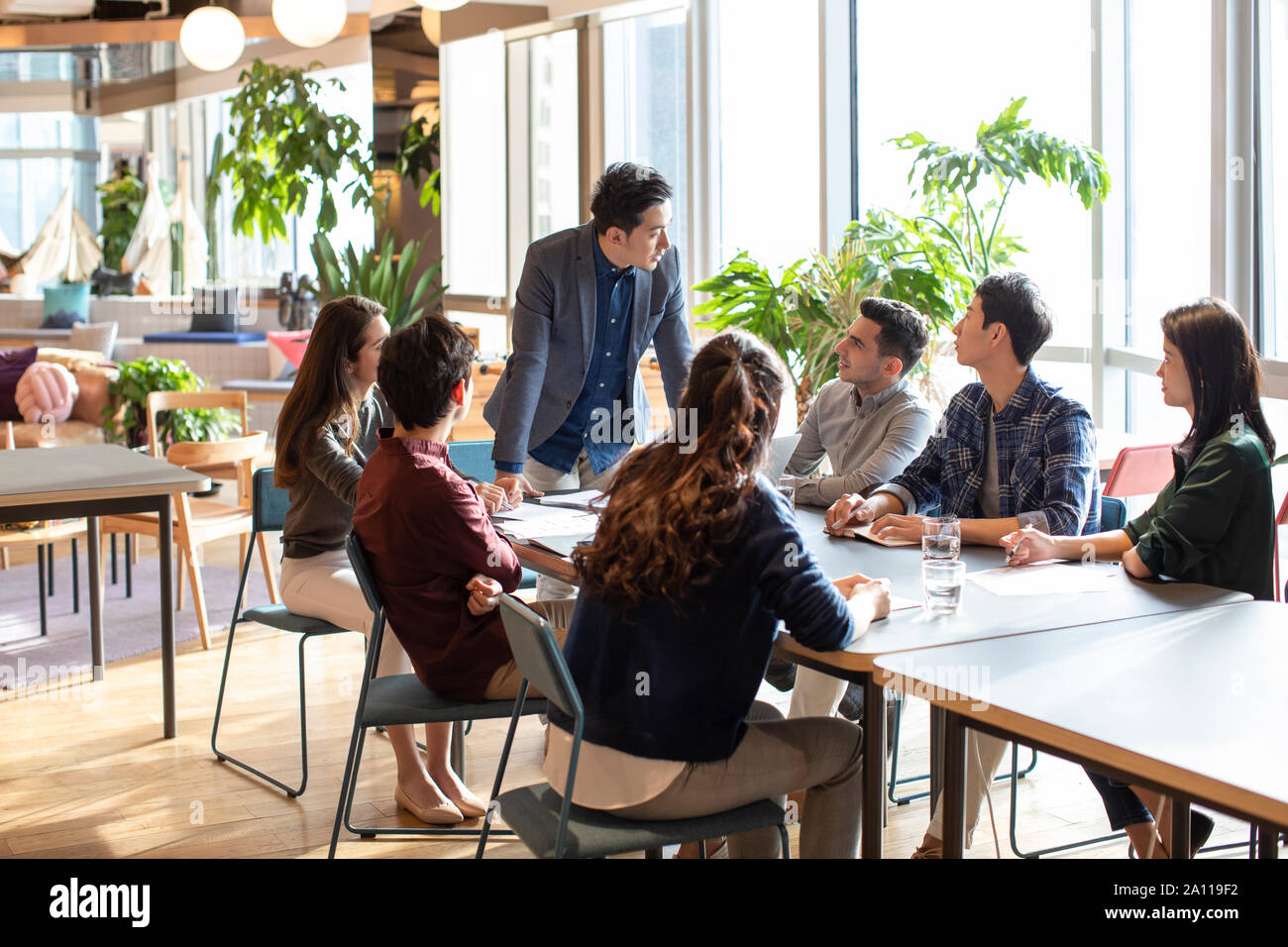 Young abroad students talking with teacher Stock Photo - Alamy