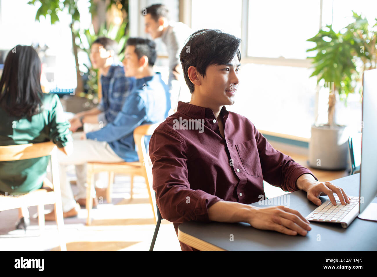 Young abroad student using computer Stock Photo