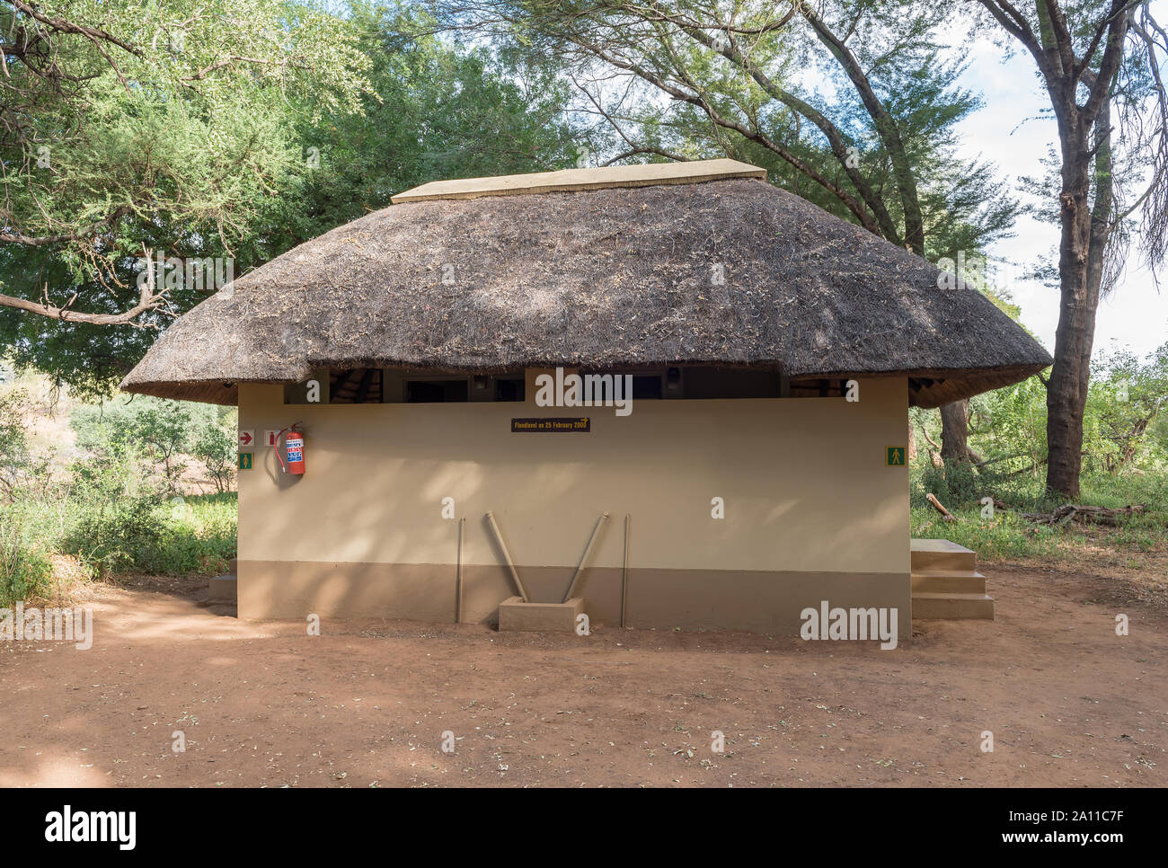KRUGER NATIONAL PARK, SOUTH AFRICA - MAY 15, 2019: Toilet facilities at the Pafuri Picnic Site. A fire extinguisher and the 2000 flood level are visib Stock Photo