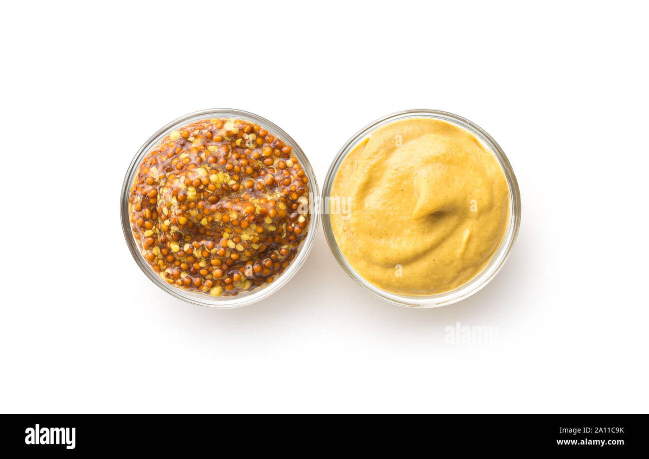 Yellow mustard and whole grain mustard isolated on white background