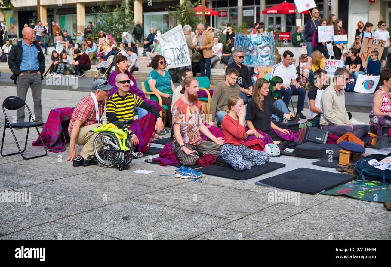 Climate change protesters sitting in Old Market Square at the 20th September 2019 Global climate strike, Nottingham, England Stock Photo