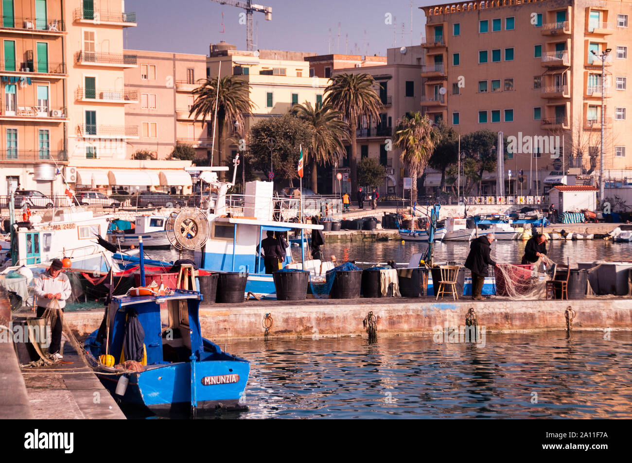 Fishermen in the Mediterranean seaside port town of Anzio, Italy, Stock Photo