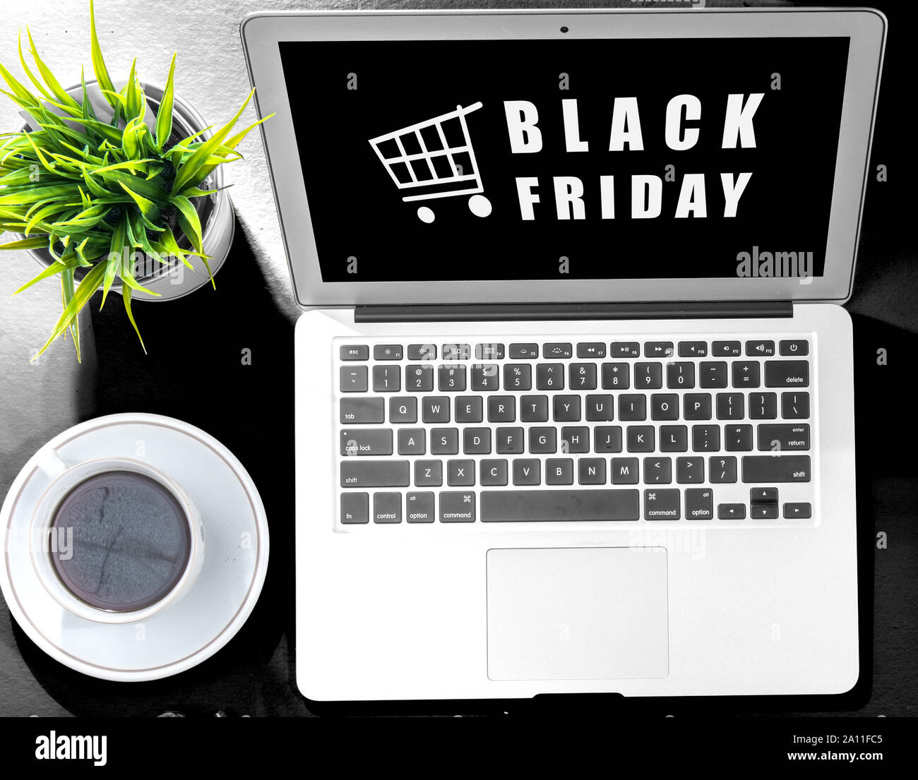 Black Friday advert on the laptop screen on the desk. Black Friday
