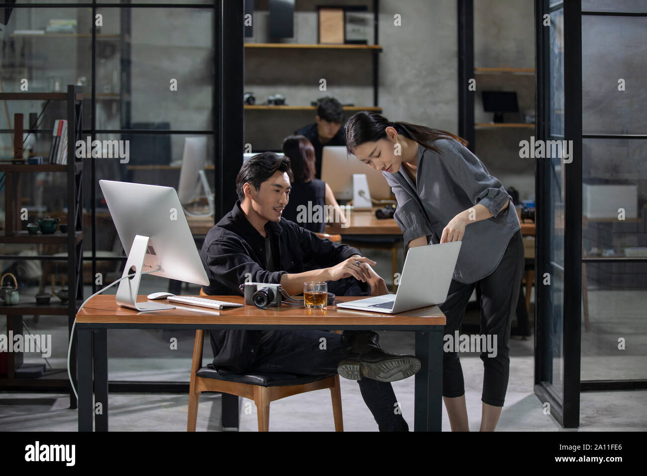 Photographers working in studio Stock Photo
