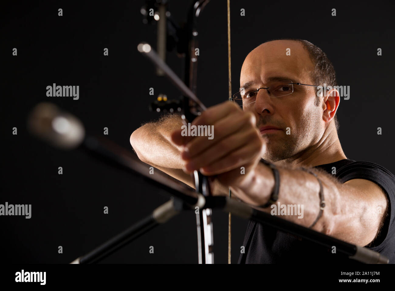 Side view of archer with bow and arrow. Stock Photo