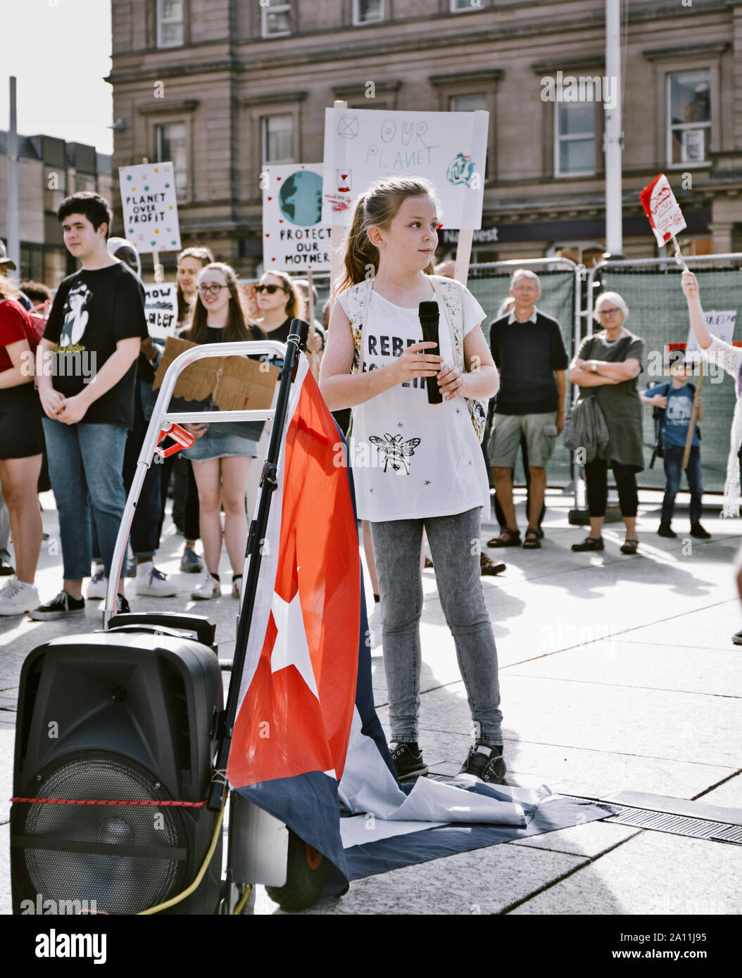 Schoolgirl activist next to Cuban flag speaking at the 20th September 2019 Global climate strike, Old Market Square, Nottingham, England Stock Photo