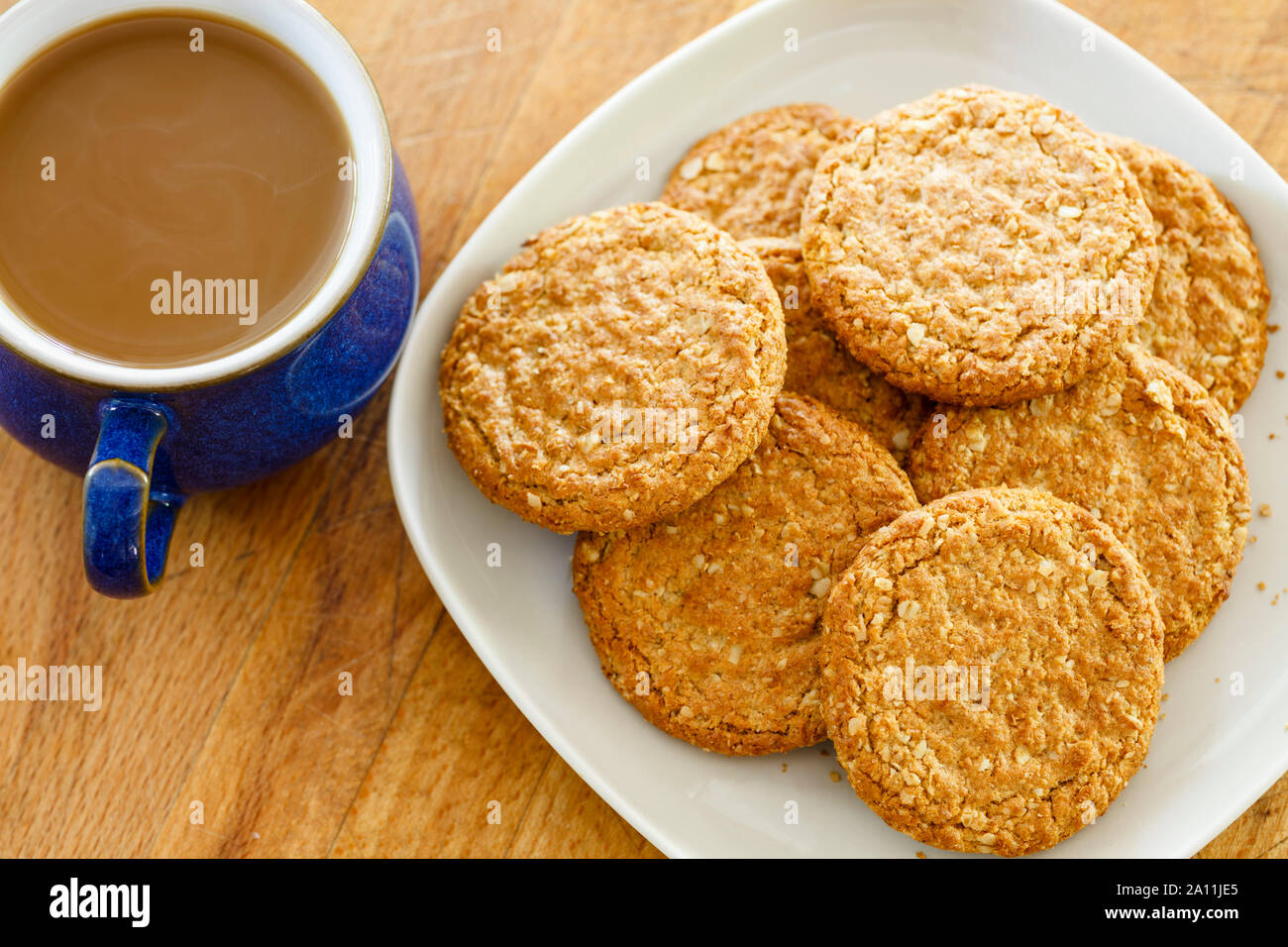 Plate of biscuits cookies and cup of coffee – overhead Stock Photo
