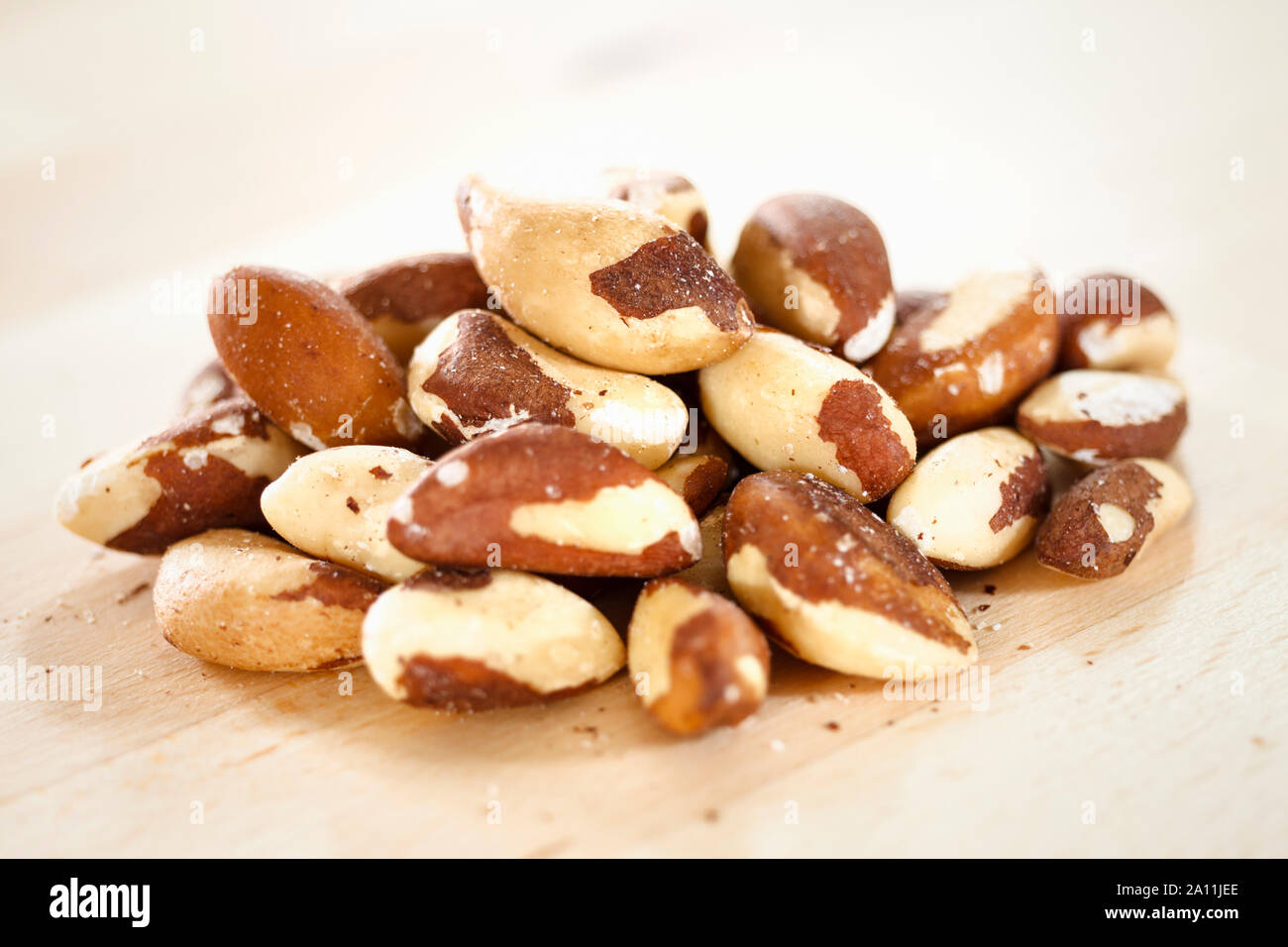 Brazil nuts on a wooden surface Stock Photo