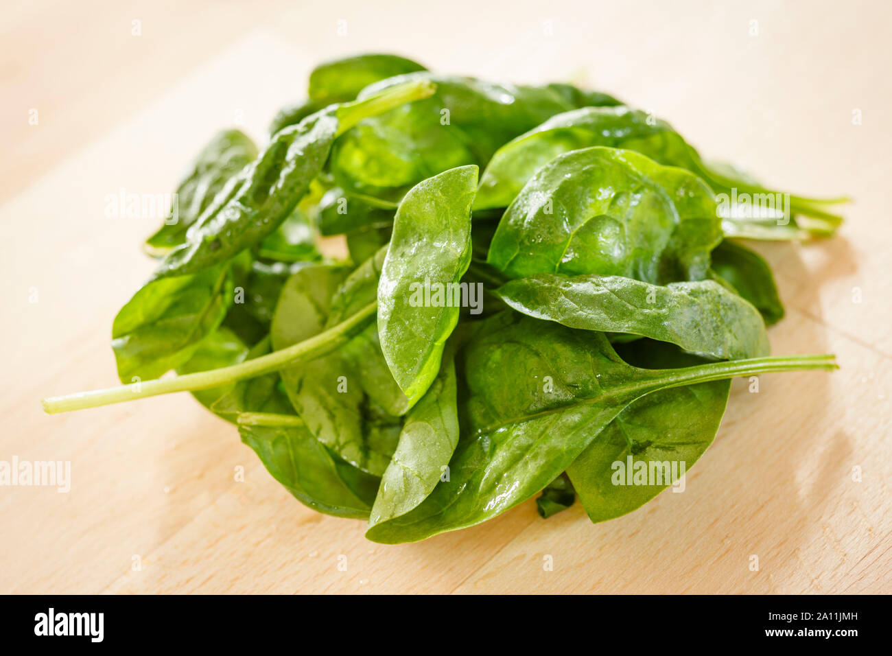 Spinach leaves in a bowl Stock Photo