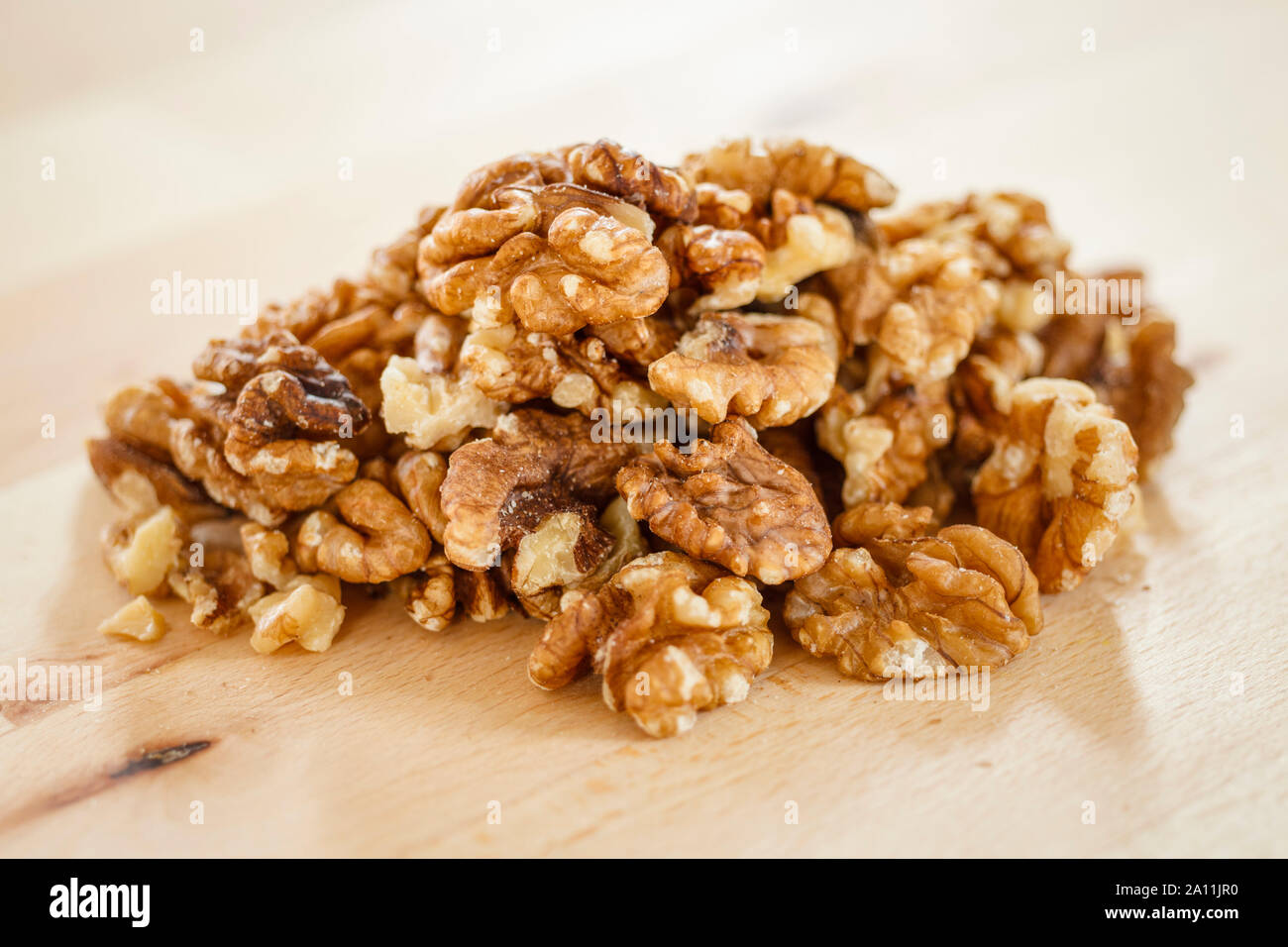 Walnuts close up, shelled, pile Stock Photo