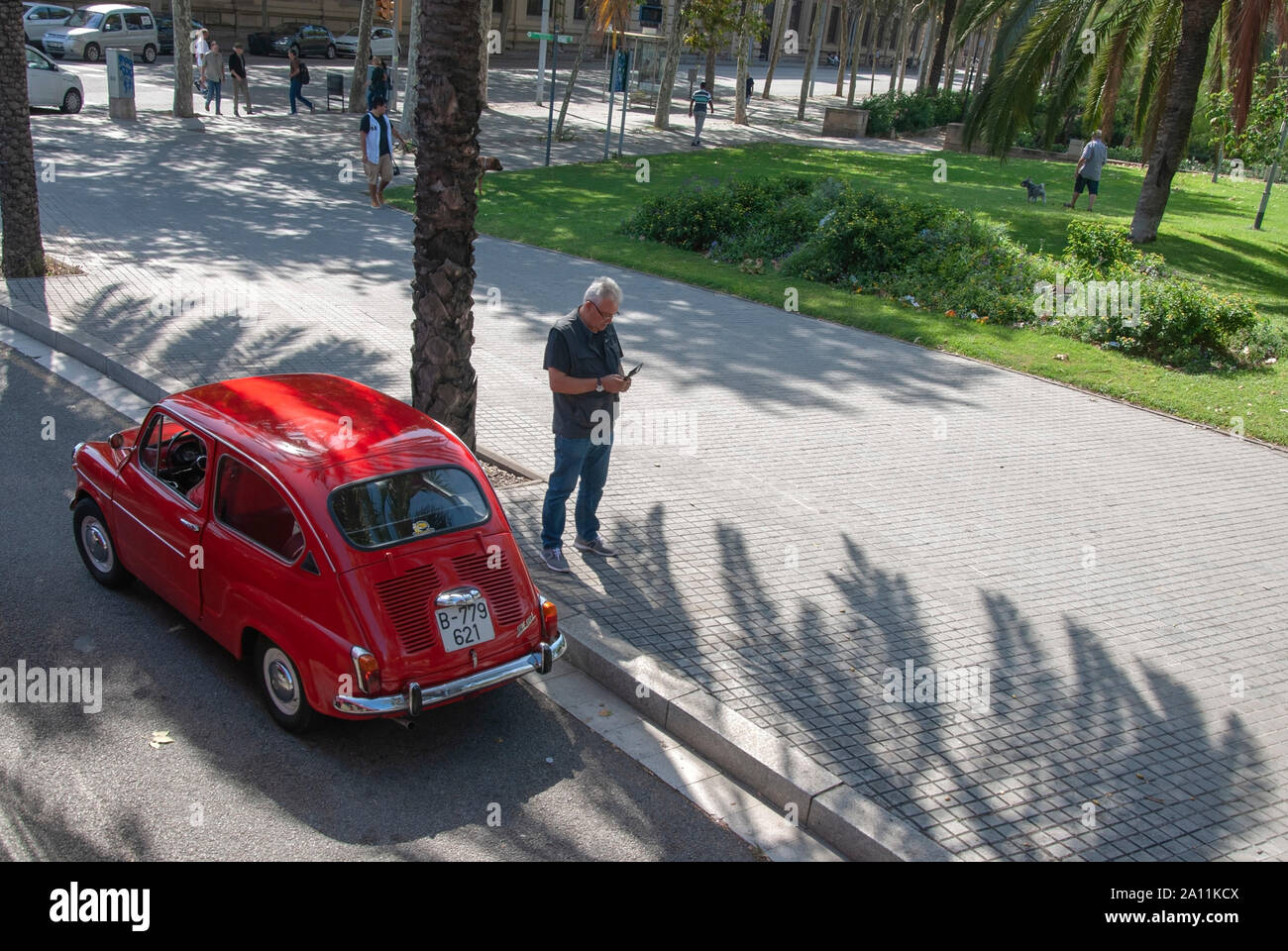 1960's Vintage Bright Red Fiat 600E Two Door Motor Car Passeig Josep Carner Central Barcelona Catalonia Spain elevated drivers left hand side view vet Stock Photo
