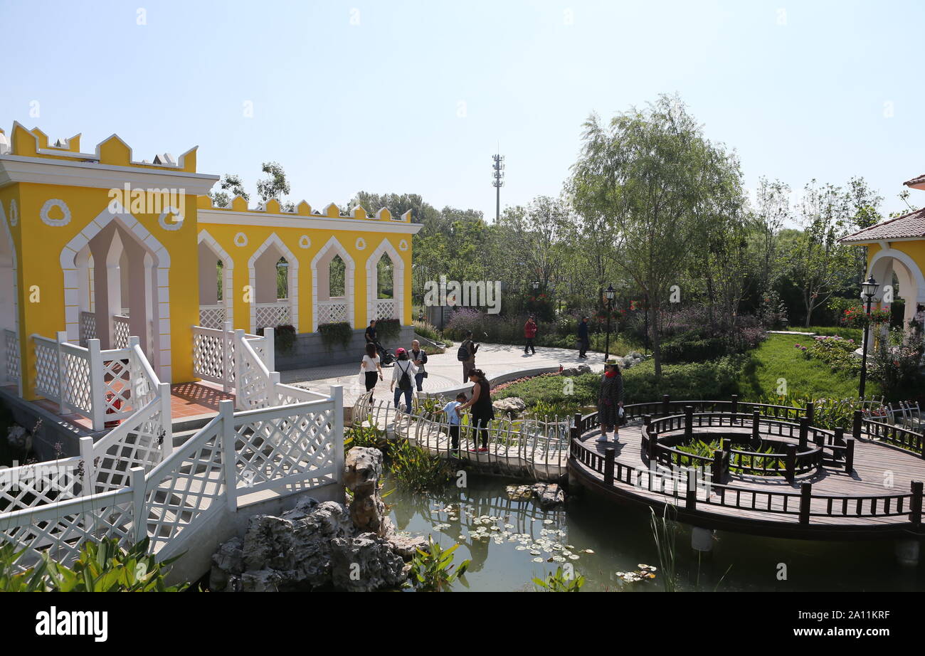(190923) --BEIJING, Sept. 23, 2019 (Xinhua) -- Visitors tour the Macao Garden during the 'Macao Day' event of the Beijing International Horticultural Exhibition in Beijing, capital of China, Sept. 22, 2019. Macao Special Administrative Region of the People's Republic of China is on the southwestern side of the Pearl River Delta. Although it is a densely populated region, with a population of about 670,000 and an area of some 33 km?, Macao has been putting efforts on ecological protection. Macao has over 20 urban parks or gardens, four rural parks and three wetland ecological zones. Its unique Stock Photo