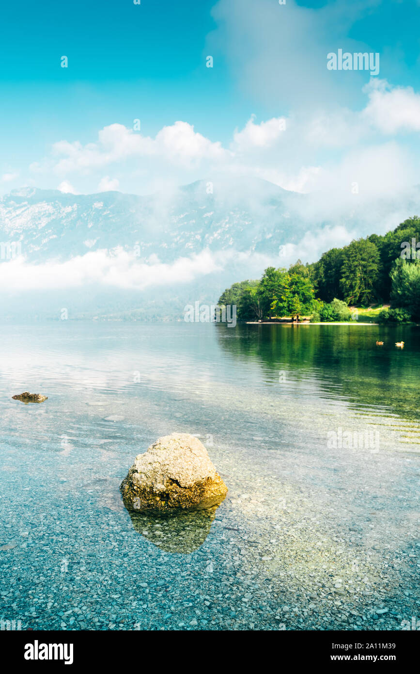 Lake Bohinj in Slovenia, beautiful scenic summer landscape of famous travel destination in Triglav national park in Alpine mountain range Stock Photo