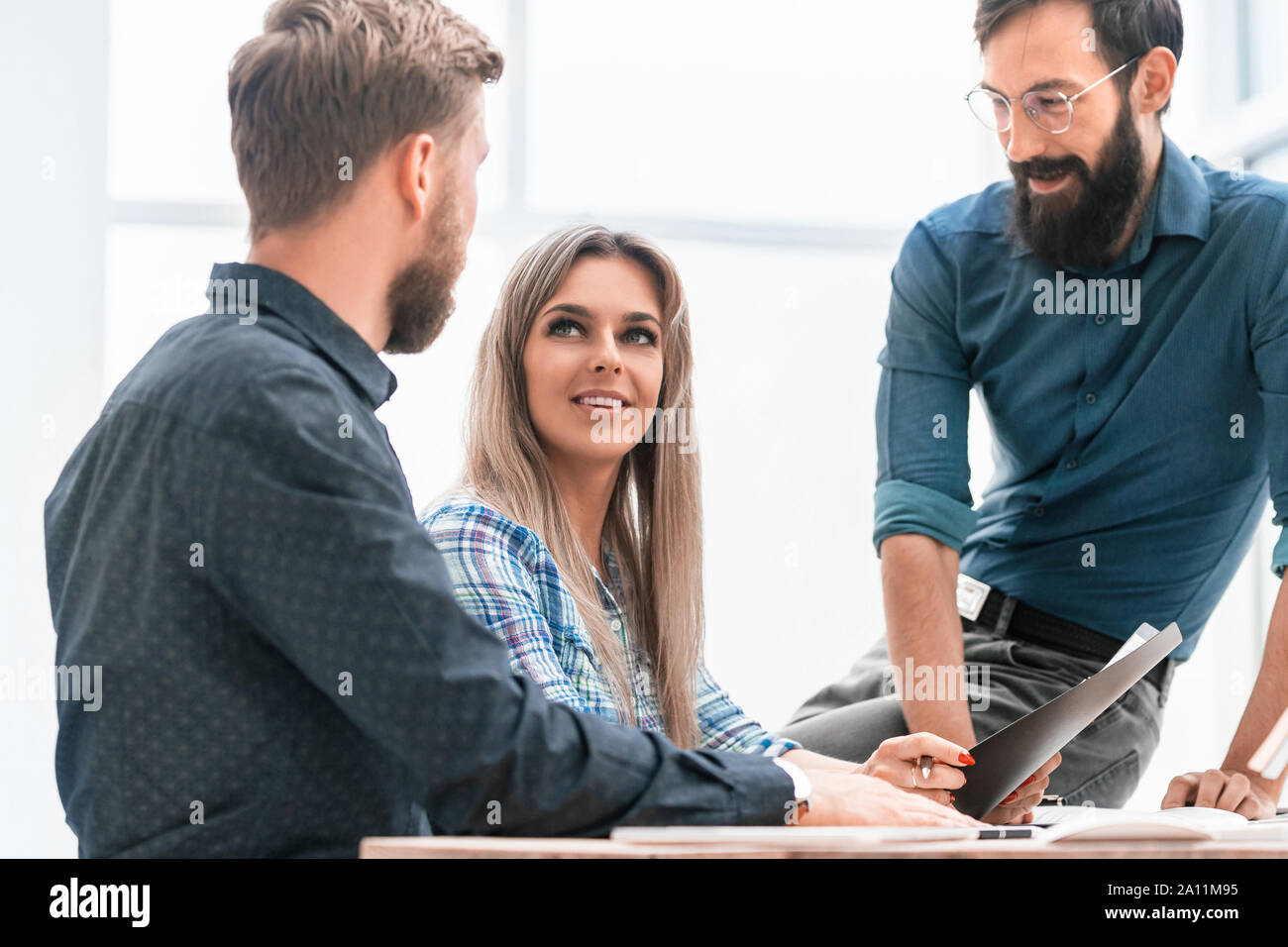 colleagues extending their hands to each other for a handshake Stock Photo