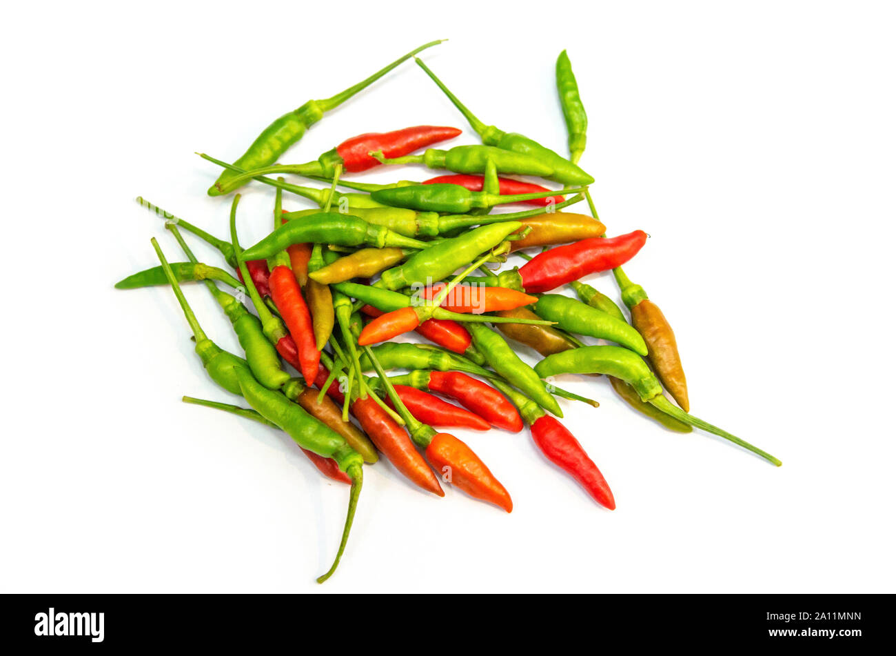 Green and red Chili peppers from a white background Stock Photo - Alamy