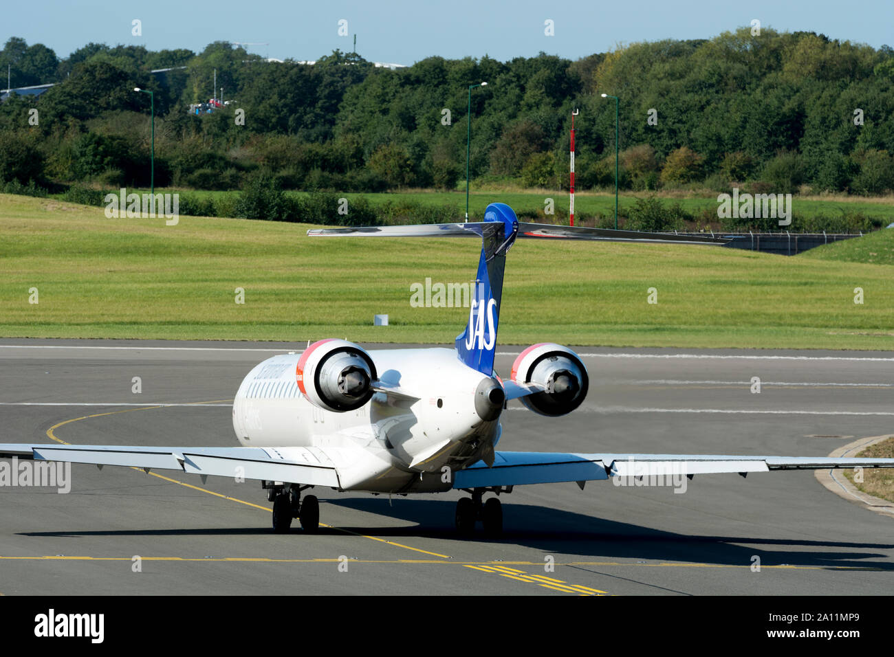 Scandinavian Airlines Bombardier CRJ-900LR taxiing at Birmingham Airport, UK (EI-FPK) Stock Photo
