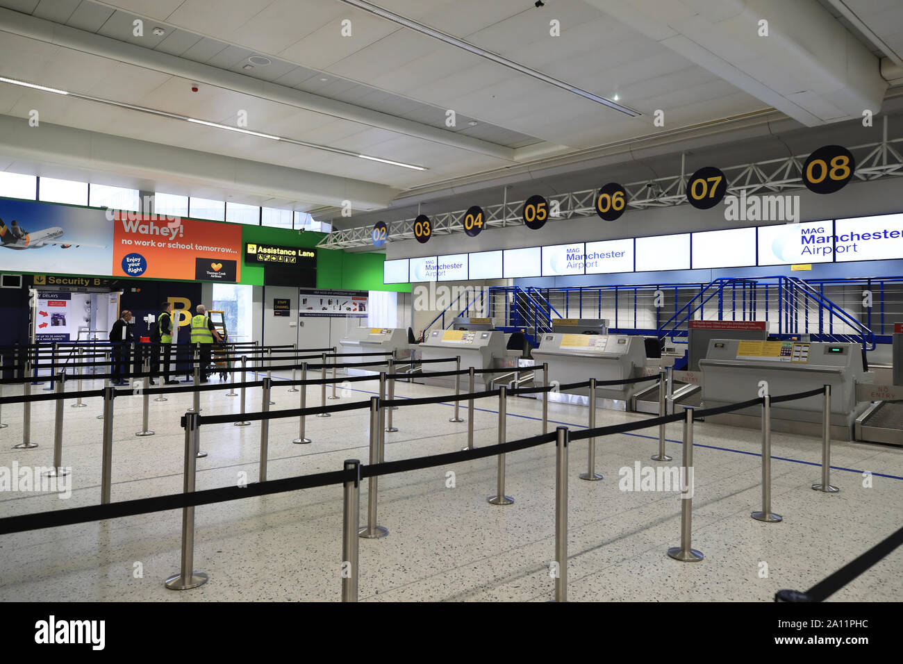 Empty check-in desks at Manchester Airport as the 178-year-old tour operator Thomas Cook has ceased trading with immediate effect after failing in a final bid to secure a rescue package from creditors. Stock Photo