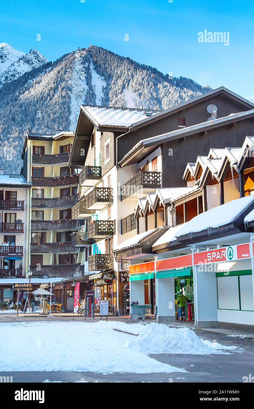 Chamonix, France - January 30, 2015: Spar Store in Chamonix town in French Alps, France and mountains at the background Stock Photo