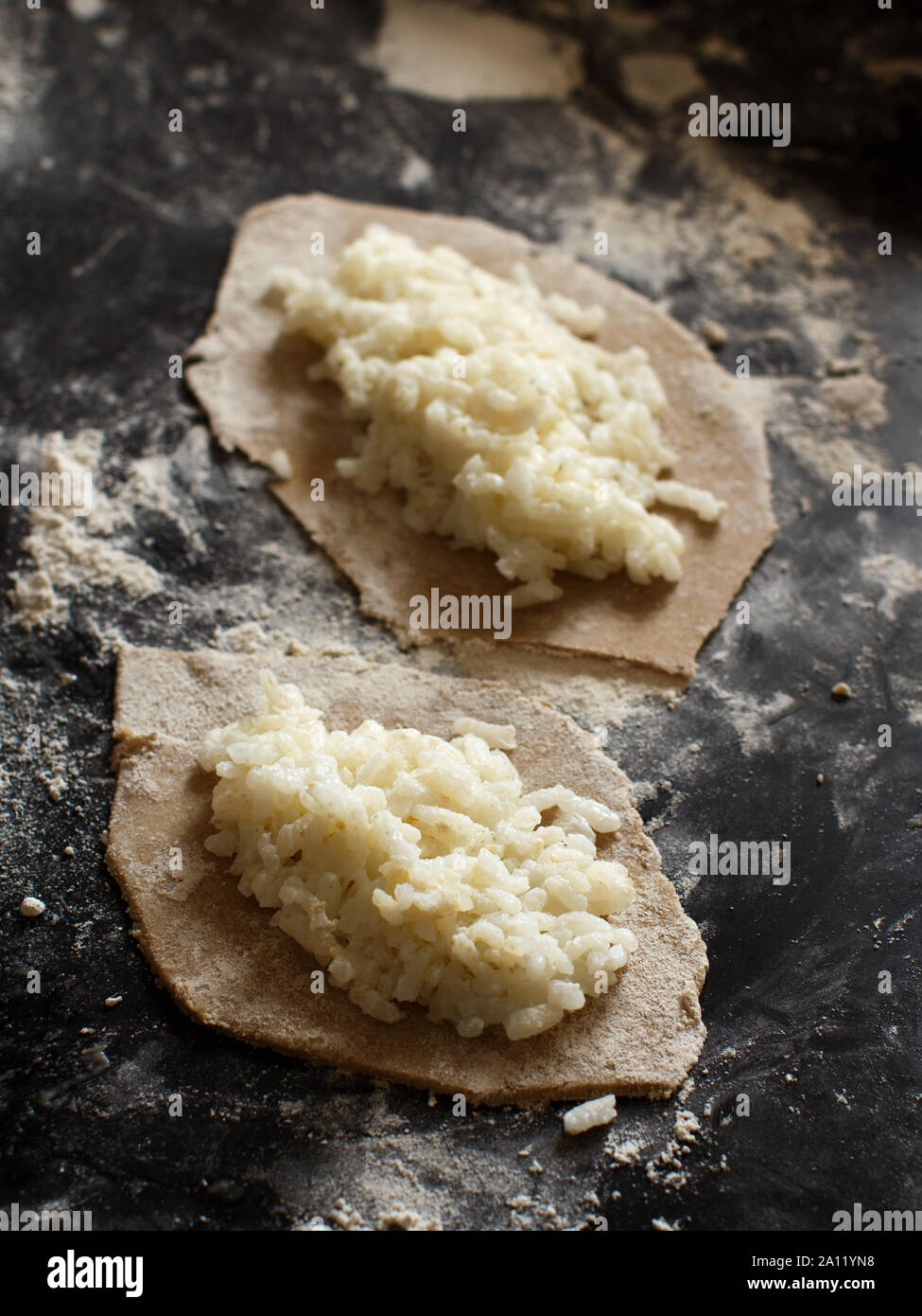 Traditional karelian pasties with rice before oven Stock Photo
