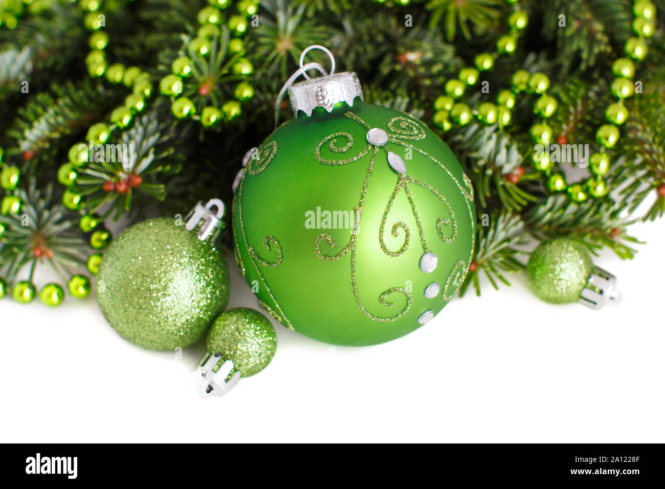 Green Christmas ornaments border on white background Stock Photo - Alamy