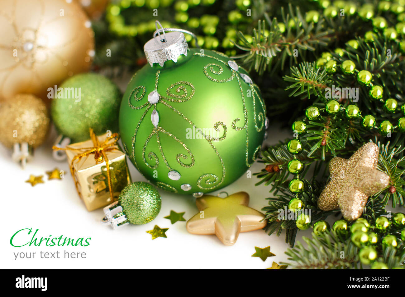 Green and golden Christmas ornaments border on white background Stock ...