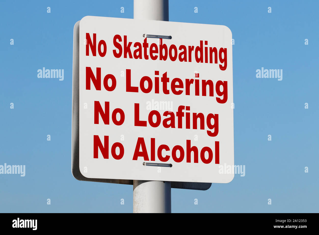 No Skateboarding No Loitering No Loafing No Alcohol Warning sign Stock Photo