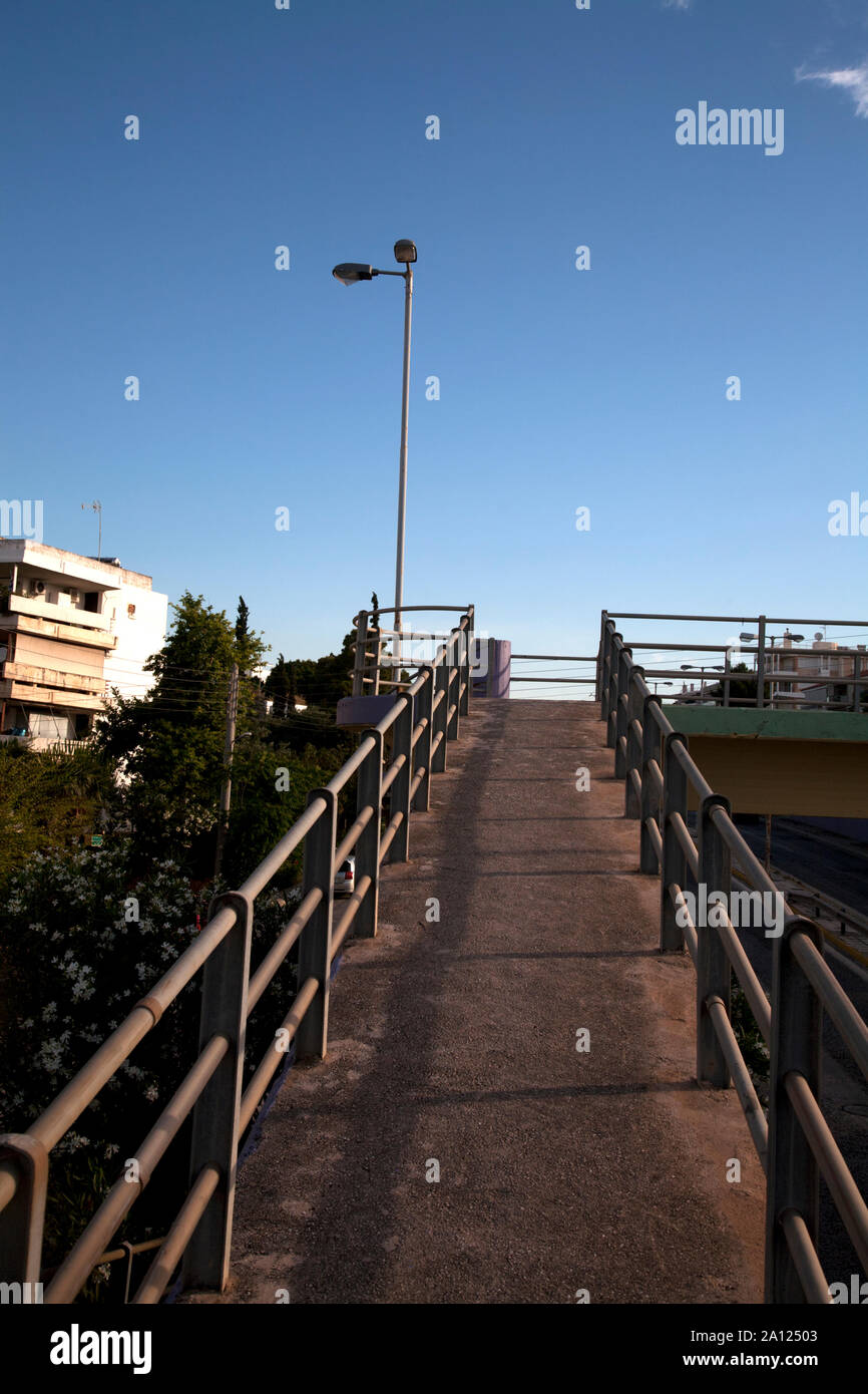 pedestrian ramp to bridge over road vouliagmeni athens attica greece Stock Photo