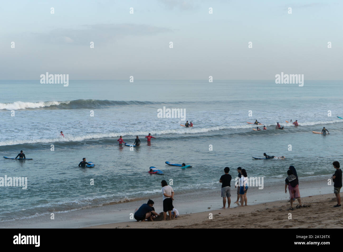 KUTA/BALI,July 06 2019-Kuta beach atmosphere in the morning filled with local and foreign tourists. Kuta beach is a favorite tourist destination Stock Photo