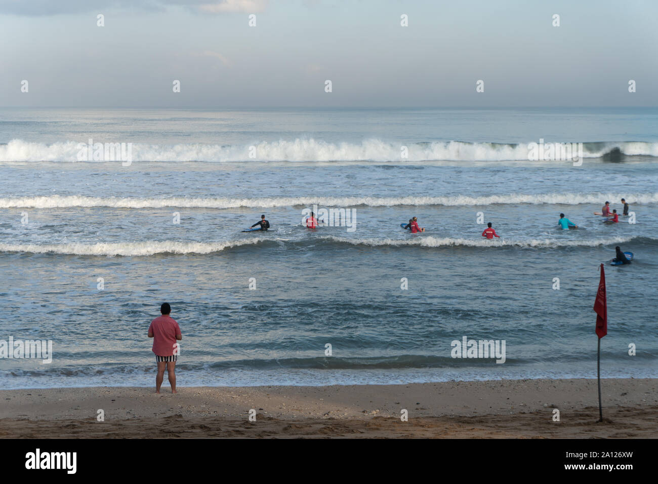 KUTA/BALI,July 06 2019-Kuta beach atmosphere in the morning filled with local and foreign tourists. Kuta beach is a favorite tourist destination Stock Photo