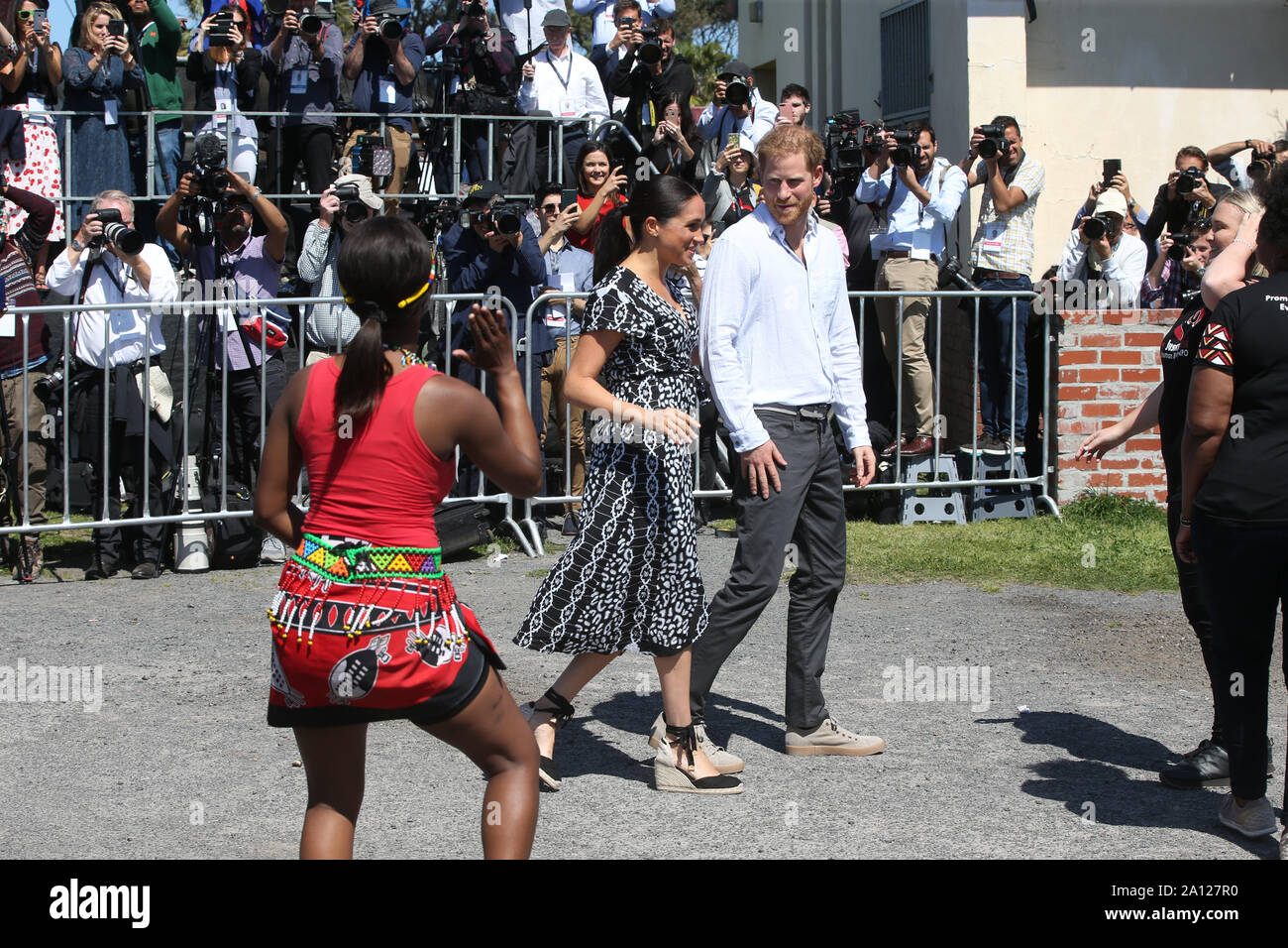 The Duke and Duchess of Sussex begin their visit to South Africa inthe Nyanga Township, Cape Town, visiting a workshop that teaches children about their rights, self-awareness and safety and which provides self-defence classes and female empowerment training to young girls in the community. Stock Photo