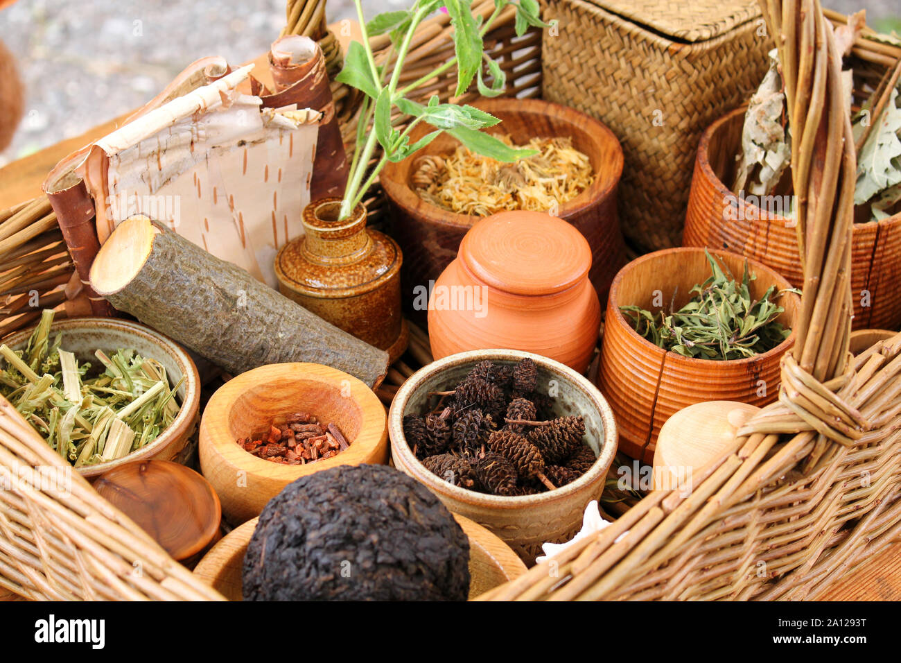 Various dried meadow herbs and herbal tea in the basket. Stock Photo