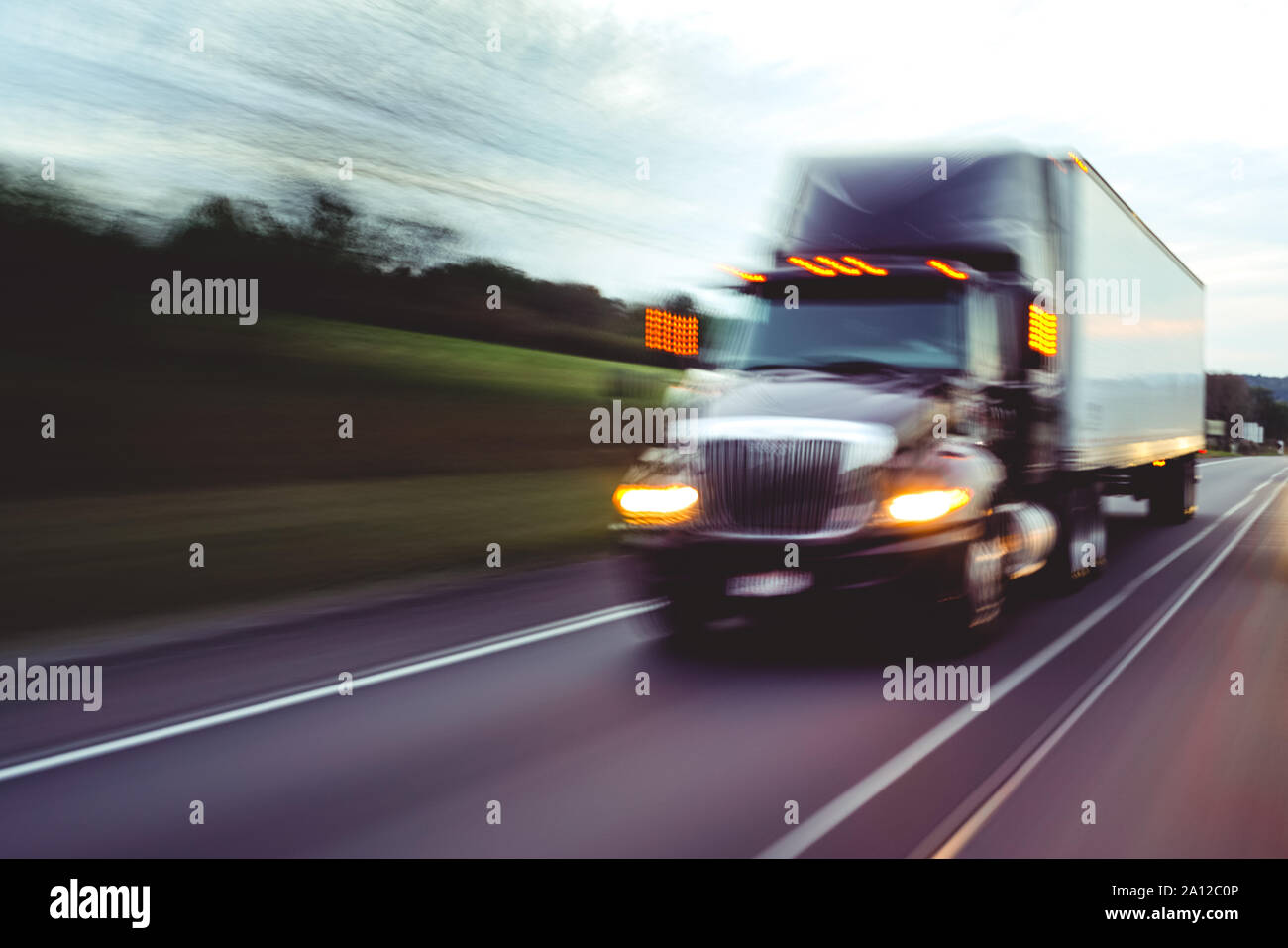 Semi truck on highway concept with motion blur Stock Photo