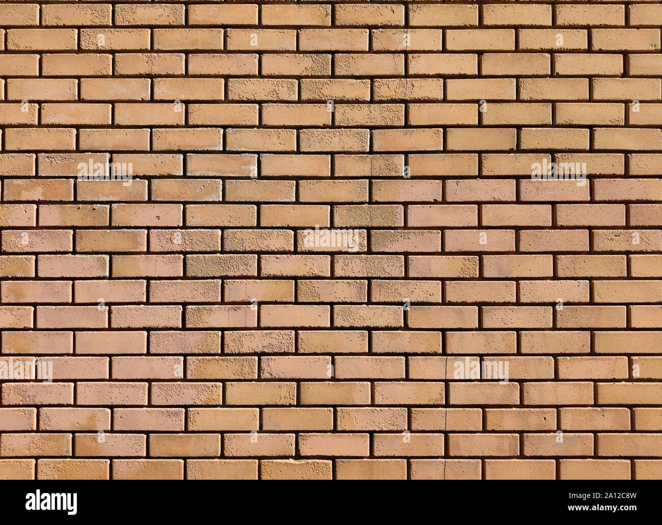 Brickwall background texture. Brown color bricks external building wall facade material Stock Photo