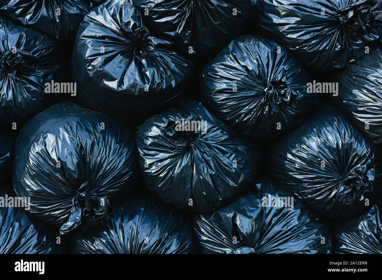 Pile of black plastic garbage bags Stock Photo - Alamy