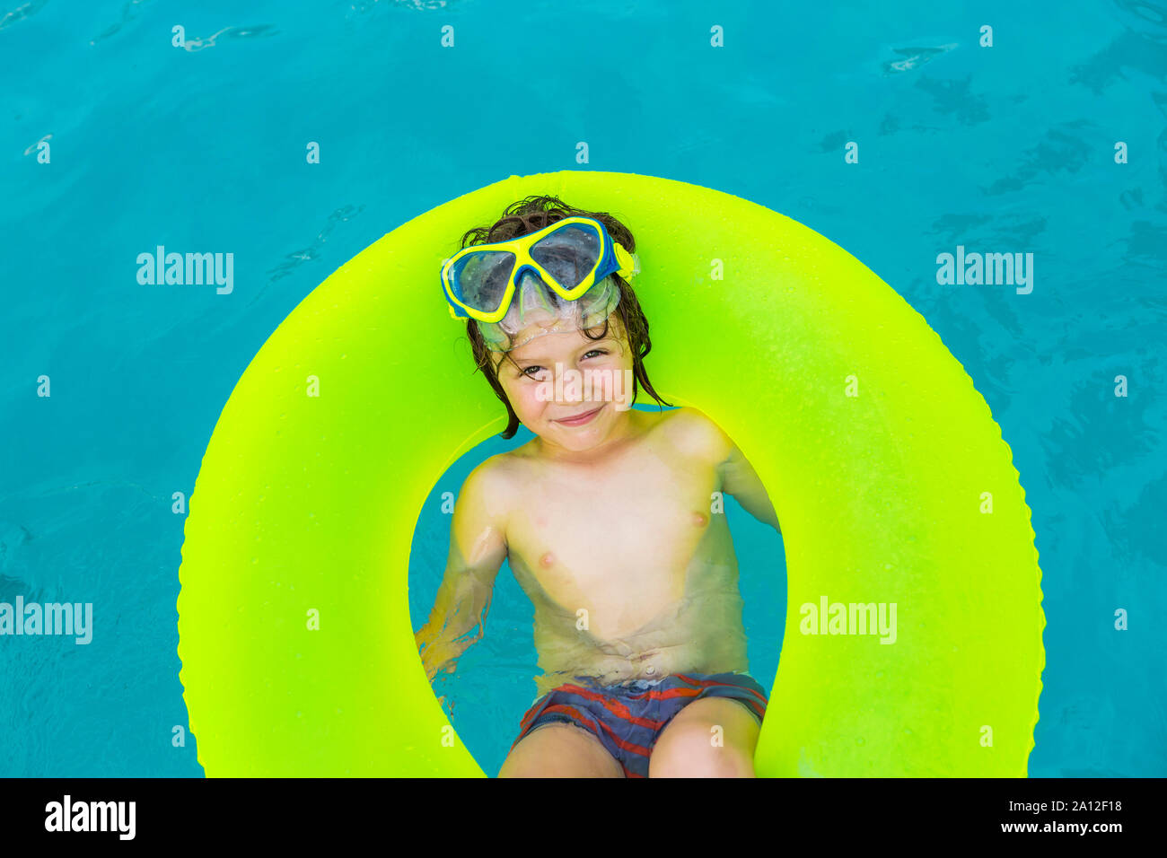 Smiling 5 Year Old Boy In Colorful Floatie Stock Photo Alamy