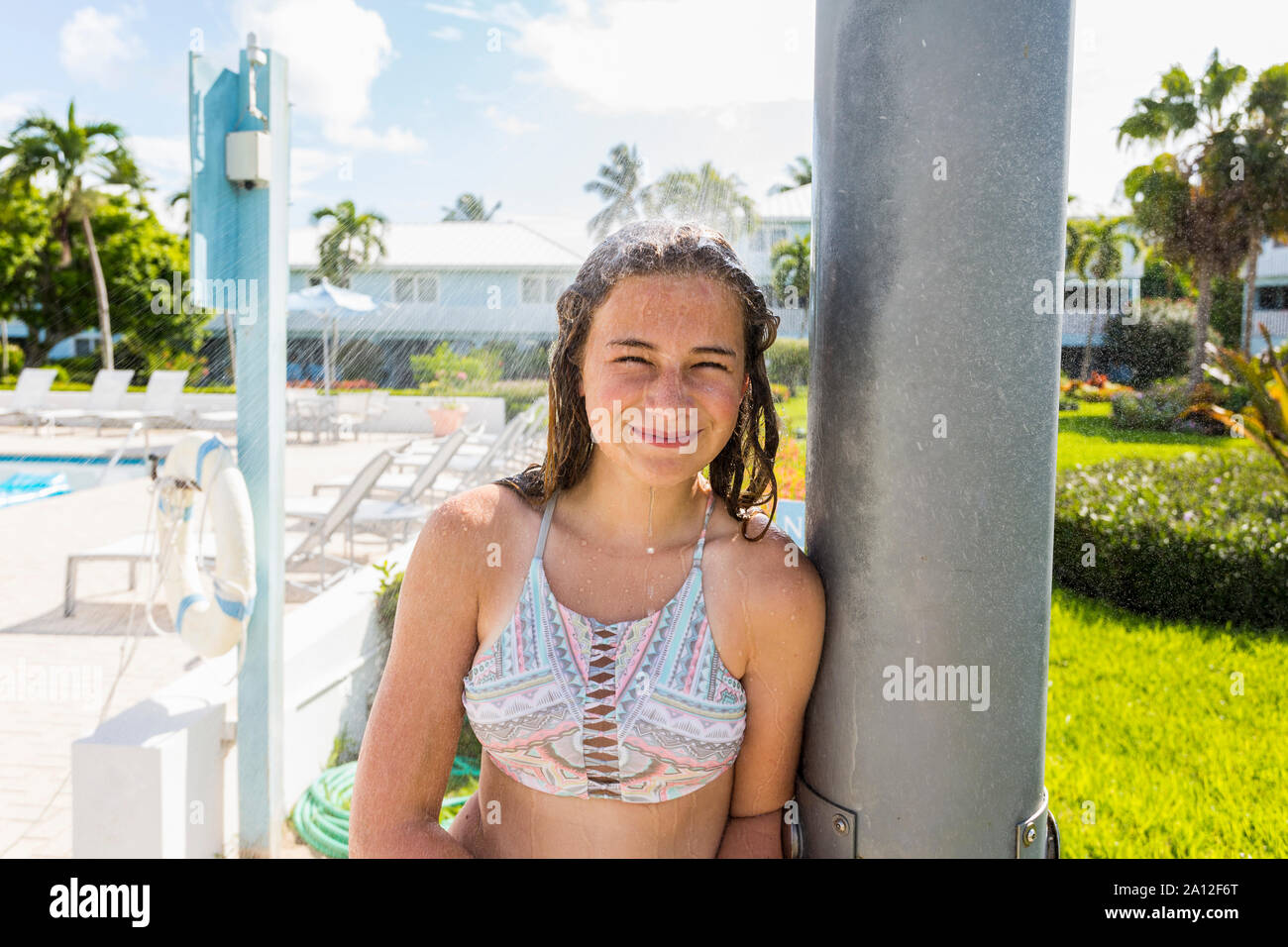 13 year old girl wearing bikini smiling at camera Stock Photo ...