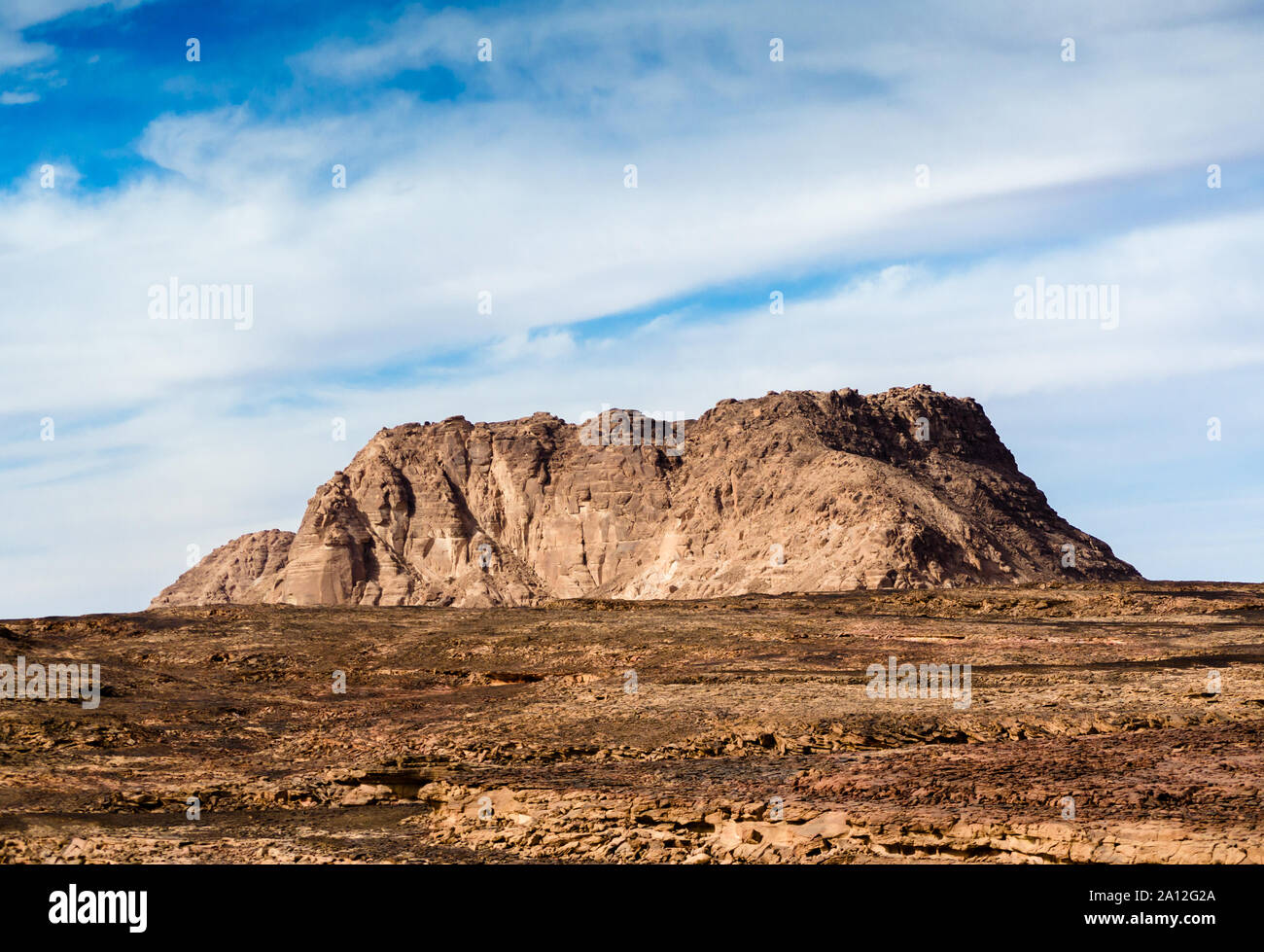 high mountain in the desert against the blue sky and white clouds Stock ...