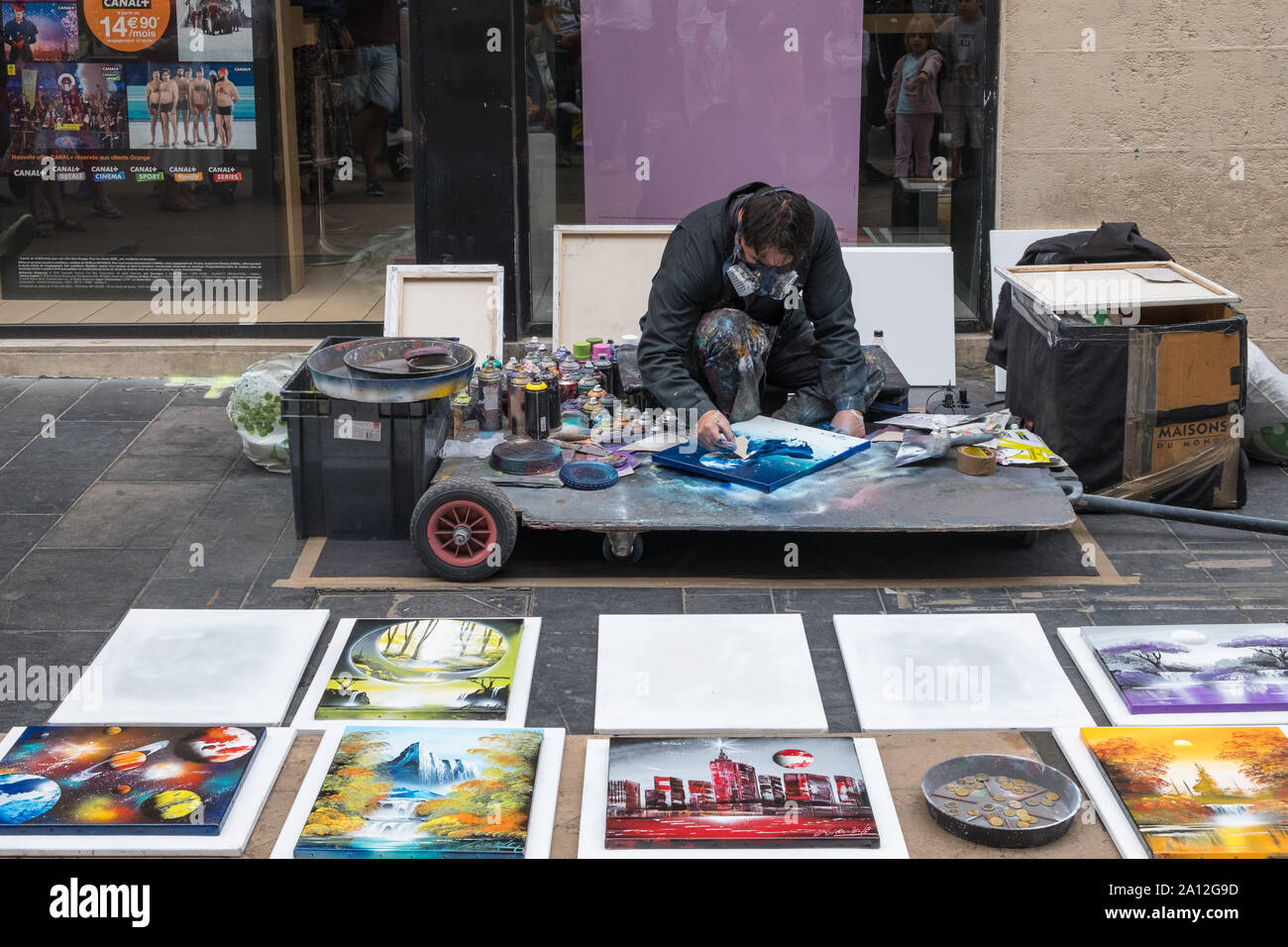 A spray paint artist making colourful paintings in Bordeaux, France