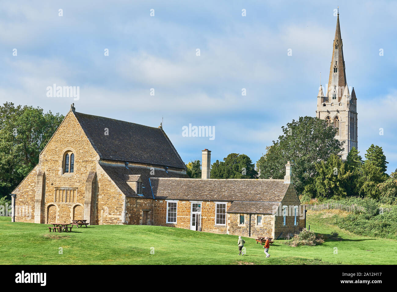 The medieval castle hall at Oakham, Rutland, England, with the spire of ...