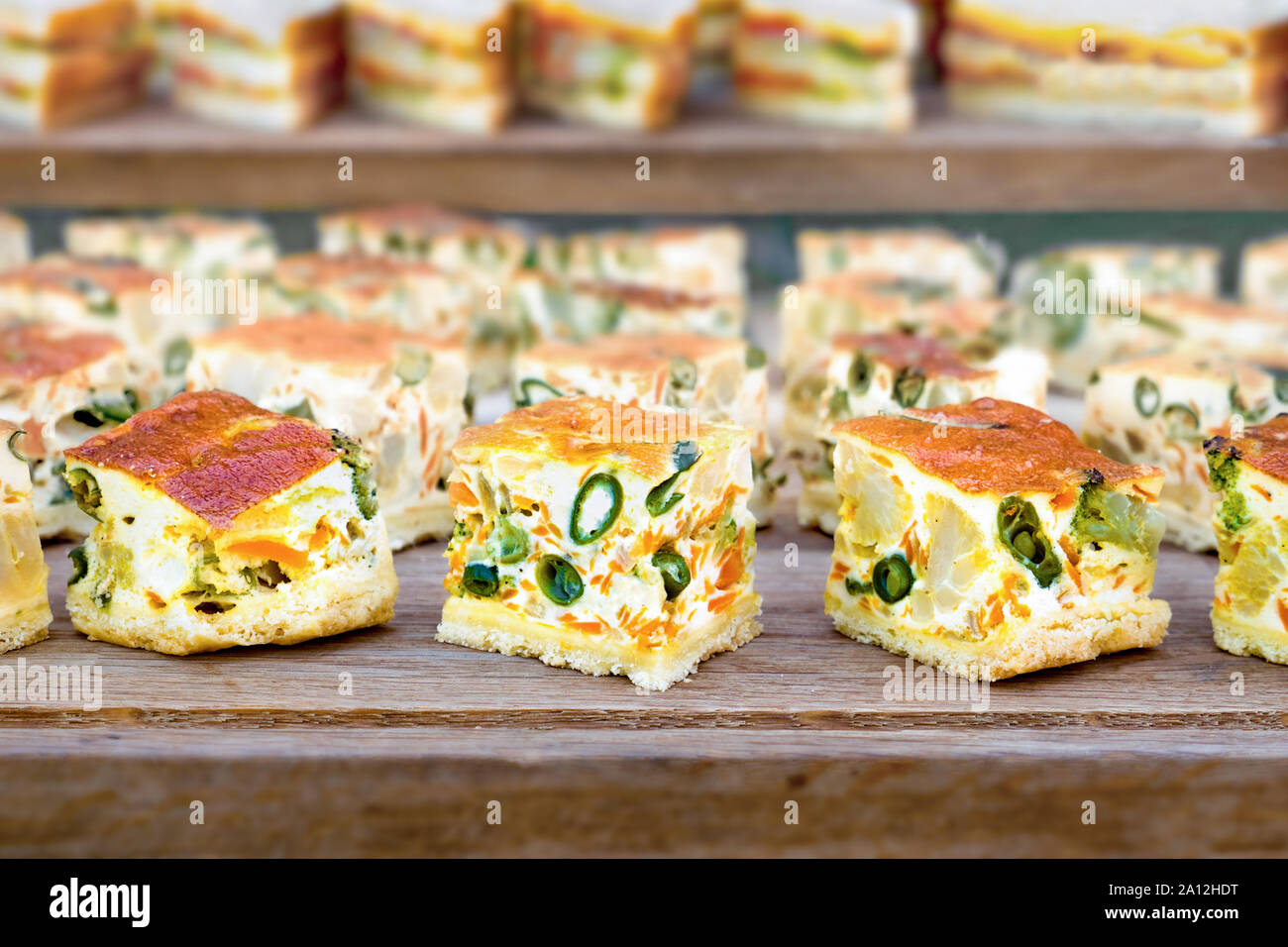 Catering background. Slider bar background. Cheap catering service. Tasty and healthy food. Street food for guests. Pieces of Pudding on wooden backgroud. Corporate events. Catering for any event Stock Photo