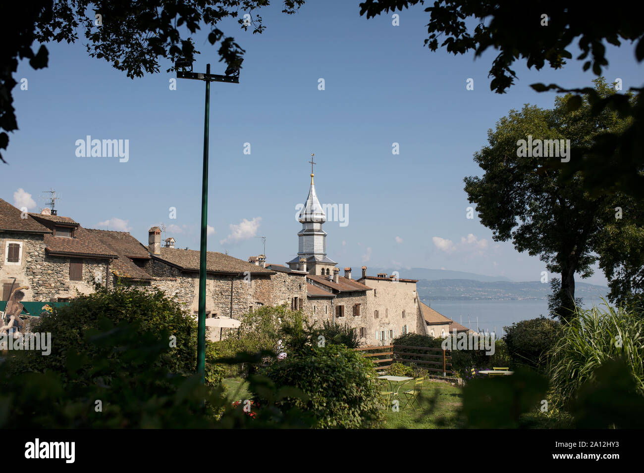 The Saint Pancrace church overlooking the town of Yvoire, France, on Lac Léman (Lake Geneva) in the department of Haute-Savoie, Auvergne-Rhône-Alpes. Stock Photo