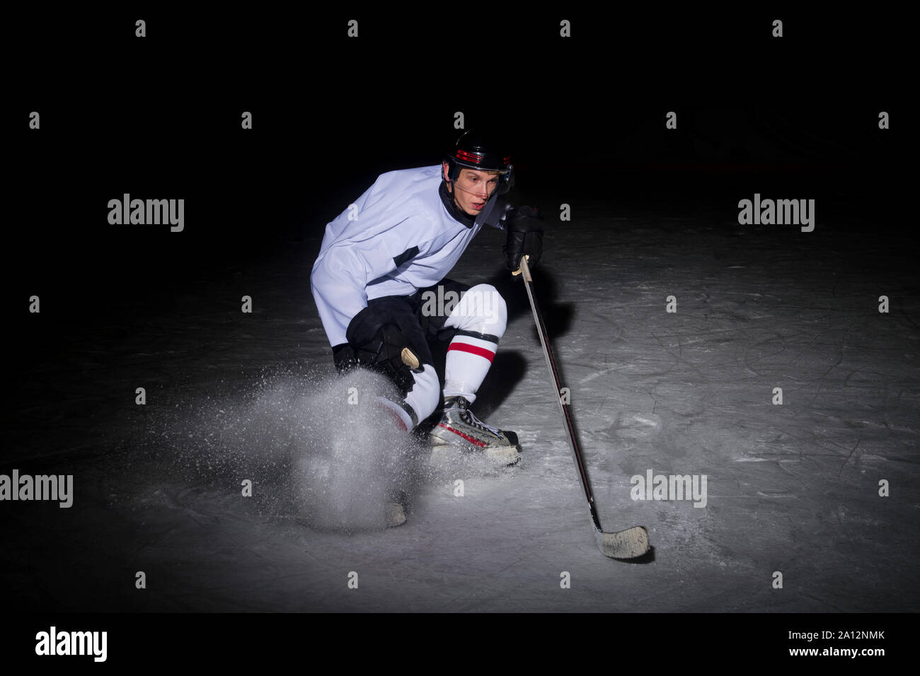 ice hockey Players in dynamic action in a professional sport game play in hockey Stock Photo