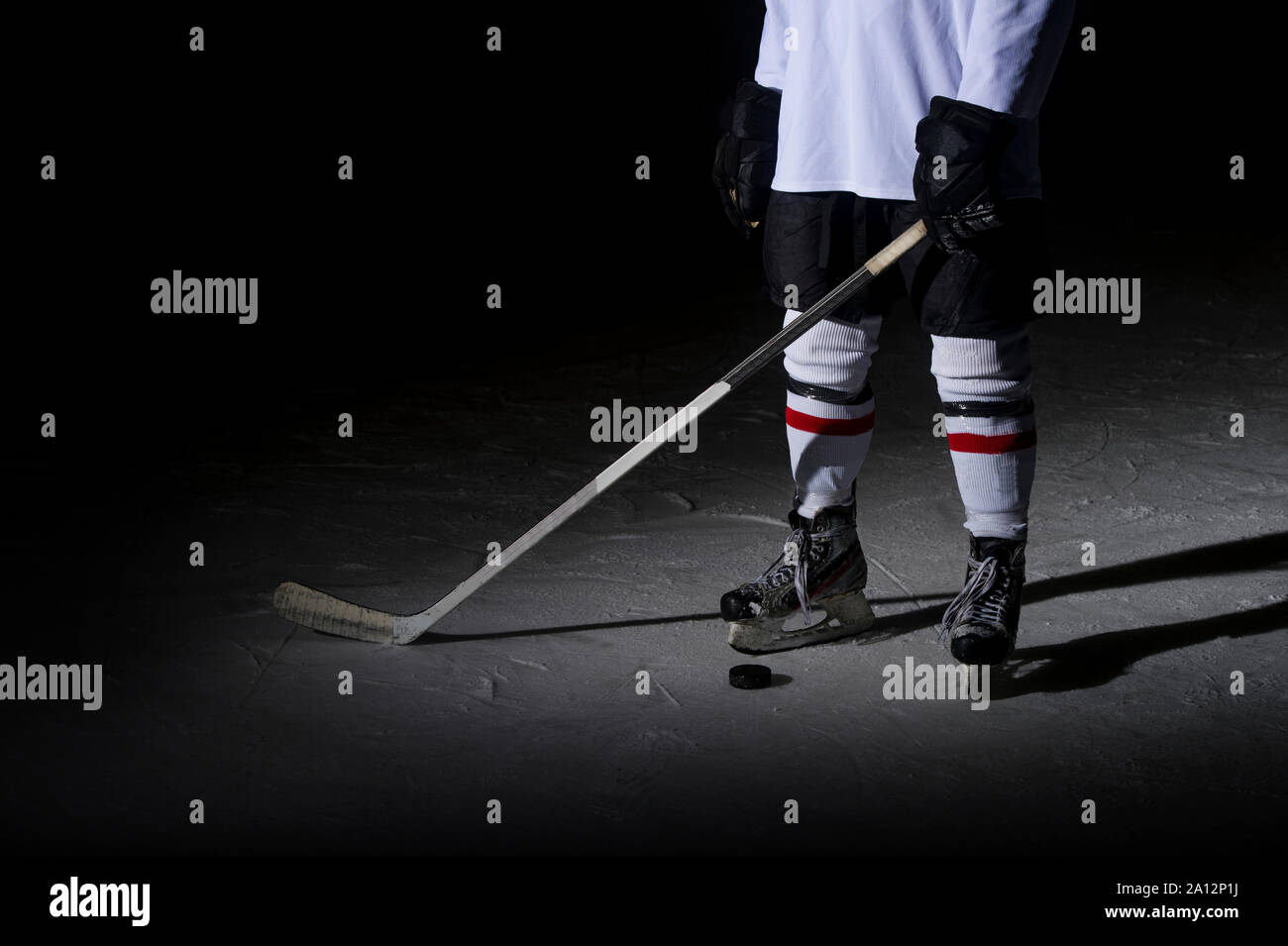 Hockey players legs closeup during a game on ice Stock Photo Alamy