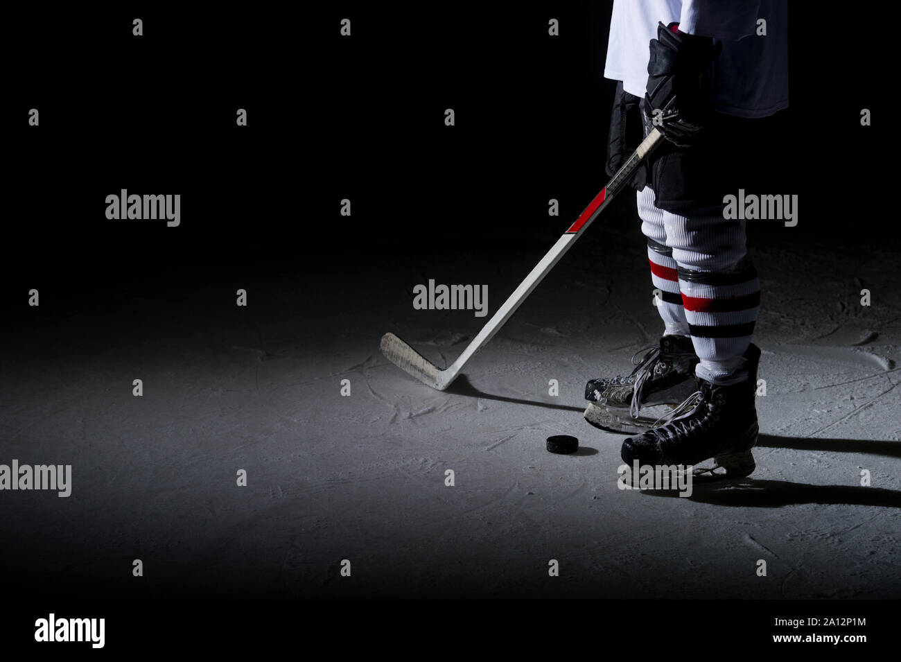 Hockey players legs closeup during a game on ice Stock Photo Alamy
