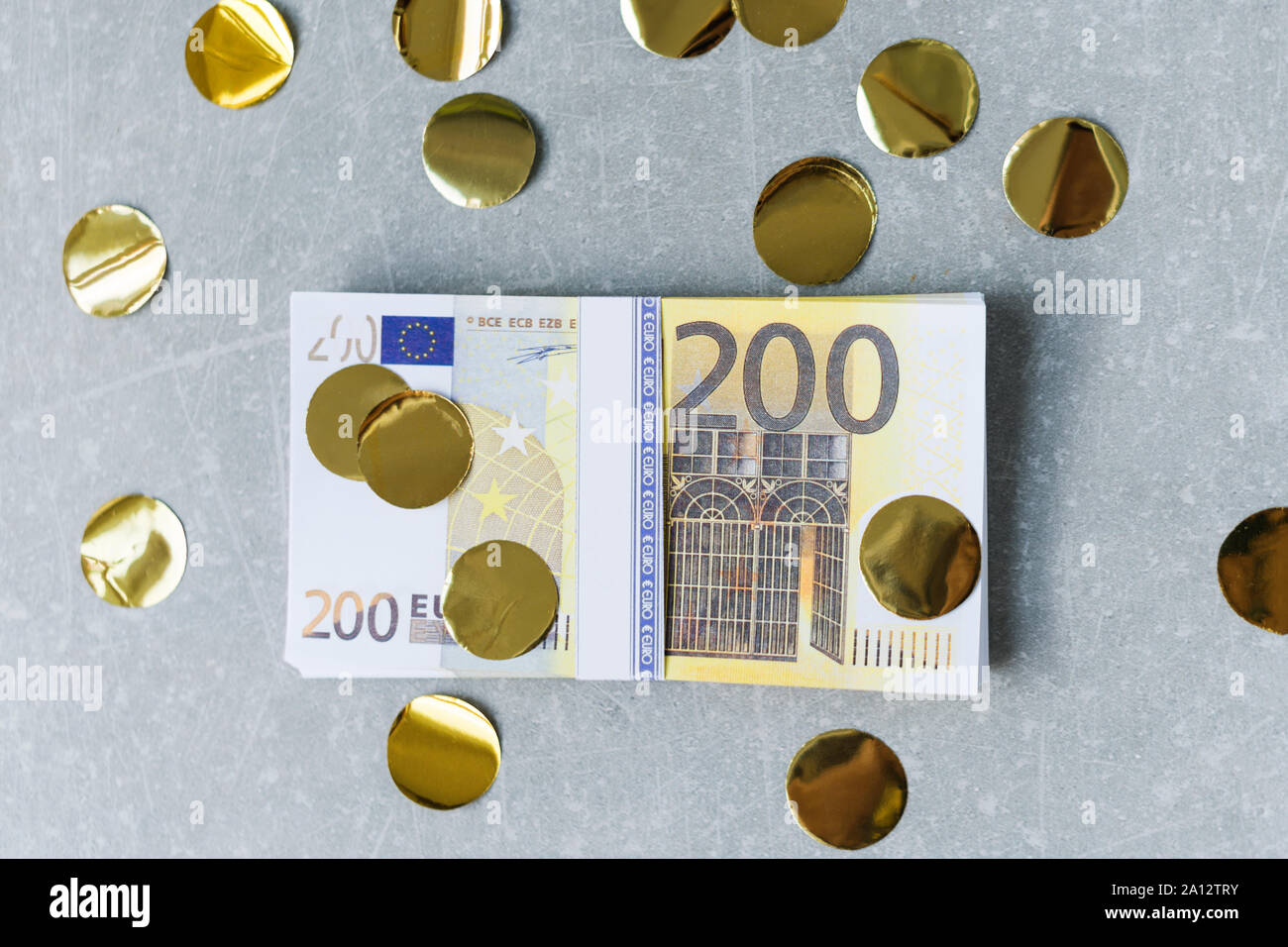 Golden confetti falling on money, euro bills. Party, bonus, reward