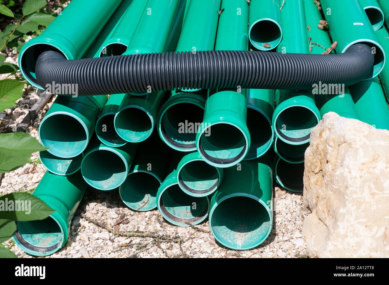 green plastic pipes for sanitary installation stored at construction site Stock Photo Alamy