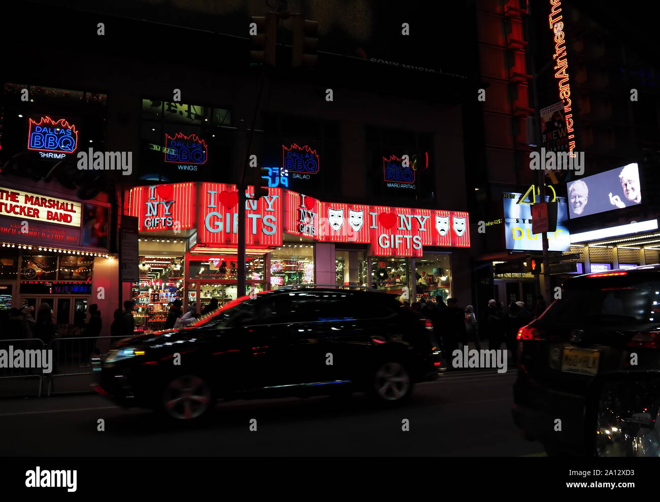 New York, NY USA. Dec 2017. Large digital display billboards, taxicabs, food, family and adult entertainment, and people all over in the Big Apple. Stock Photo